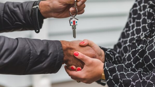 Person Holding Silver Key